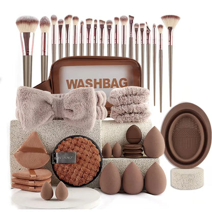Makeup brush set with washbag, towels, and beauty tools on a white background