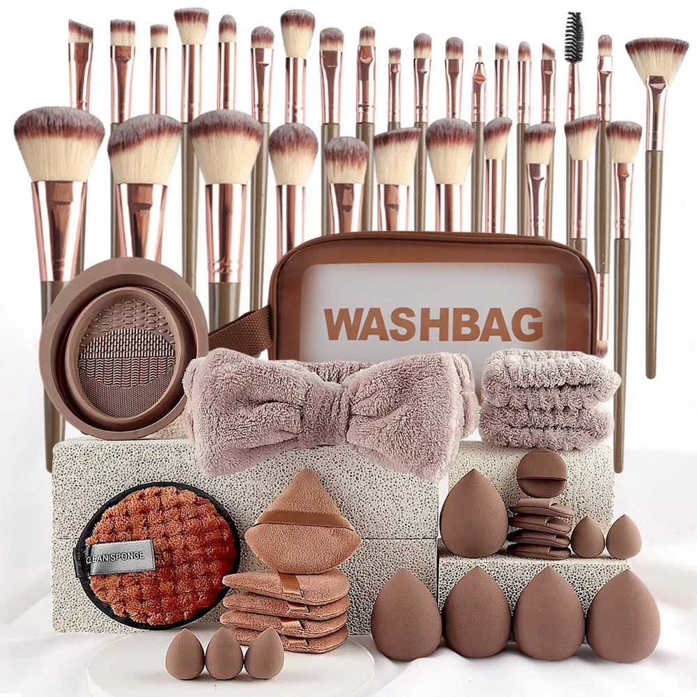 Makeup brush set with washbag and beauty tools on a white background