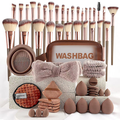 Makeup brush set with washbag and beauty tools on a white background