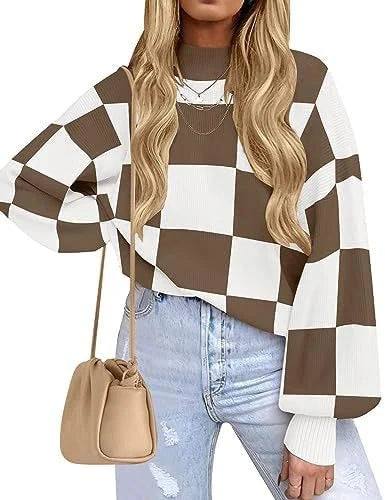 Woman wearing a brown and white checkered sweater with light blue jeans and a beige handbag.