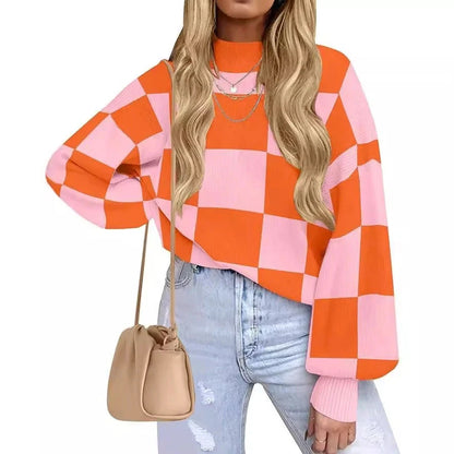 Person wearing a pink and orange checkered sweater with a beige handbag on a white background