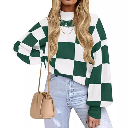 Person wearing a green and white checkered sweater with light blue jeans and a beige handbag.