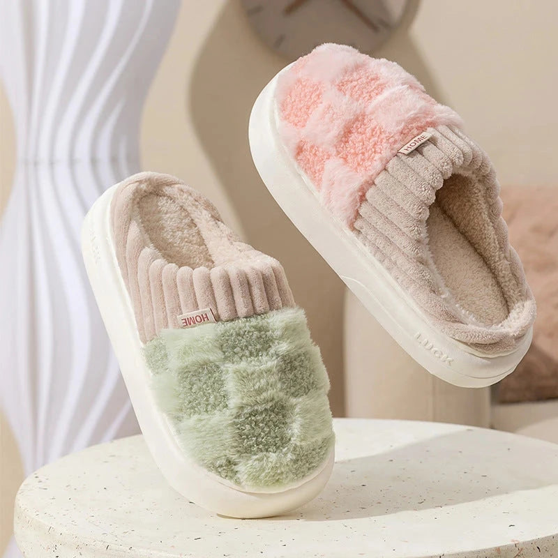 Green & pink  plush checkered slip-on house slippers with ribbed trim and light-colored soles.