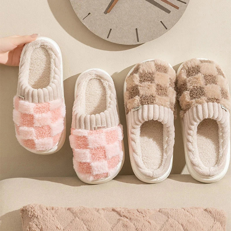 Pink & Bown plush checkered slip-on house slippers with ribbed trim and light-colored soles.