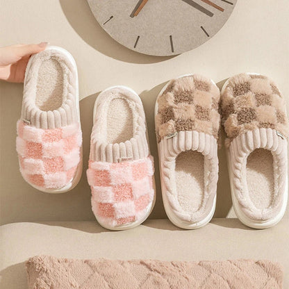 Pink & Bown plush checkered slip-on house slippers with ribbed trim and light-colored soles.