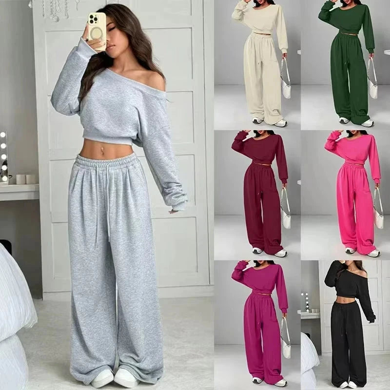 A woman models a two-piece lounge set in a mirror selfie, with six smaller color variants shown in a grid on the right. The set includes an off-the-shoulder long-sleeve crop top and matching wide-leg sweatpants.