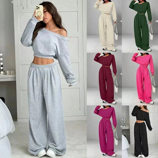 A woman models a two-piece lounge set in a mirror selfie, with six smaller color variants shown in a grid on the right. The set includes an off-the-shoulder long-sleeve crop top and matching wide-leg sweatpants.