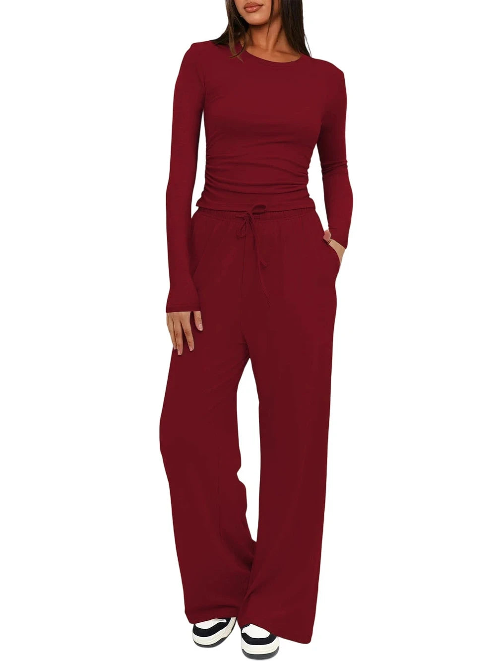 Red jumpsuit worn by a person on a white background