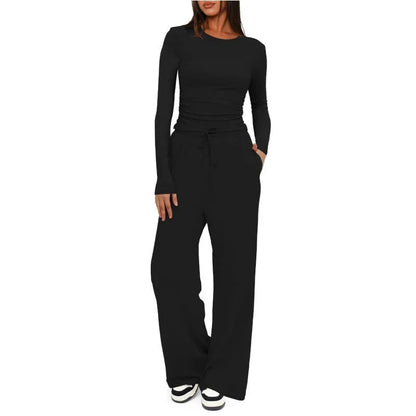 Black jumpsuit worn by a person on a white background