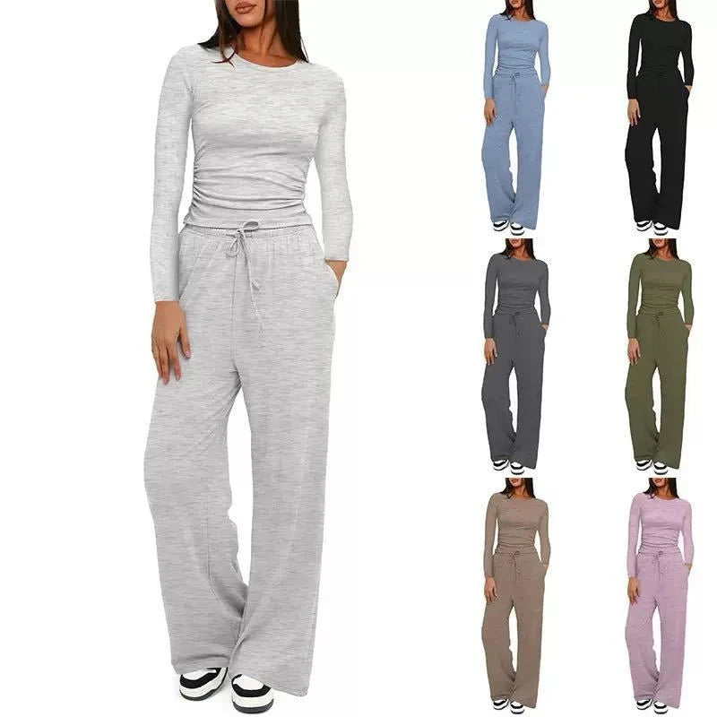 Woman wearing a gray jumpsuit with multiple color options displayed.