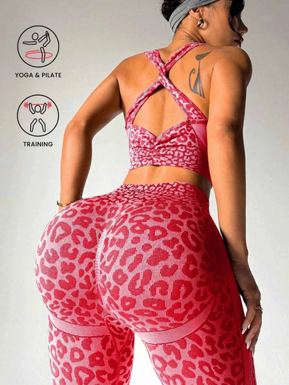 A woman shown from the back wearing a pink leopard-print sports bra and matching high-waisted leggings with sheer mesh side panels. The image includes two circular icons on the left with text reading 'YOGA & PILATE' and 'TRAINING'.