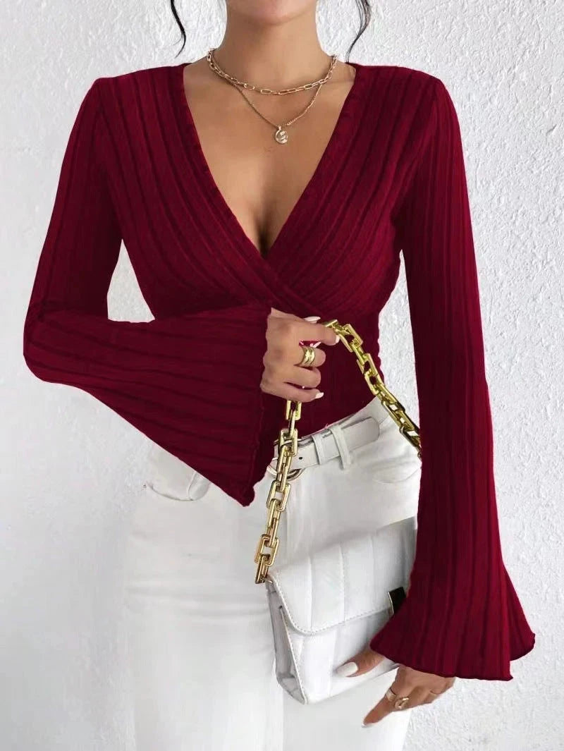 Wine Red long-sleeve top worn by a person against a white background