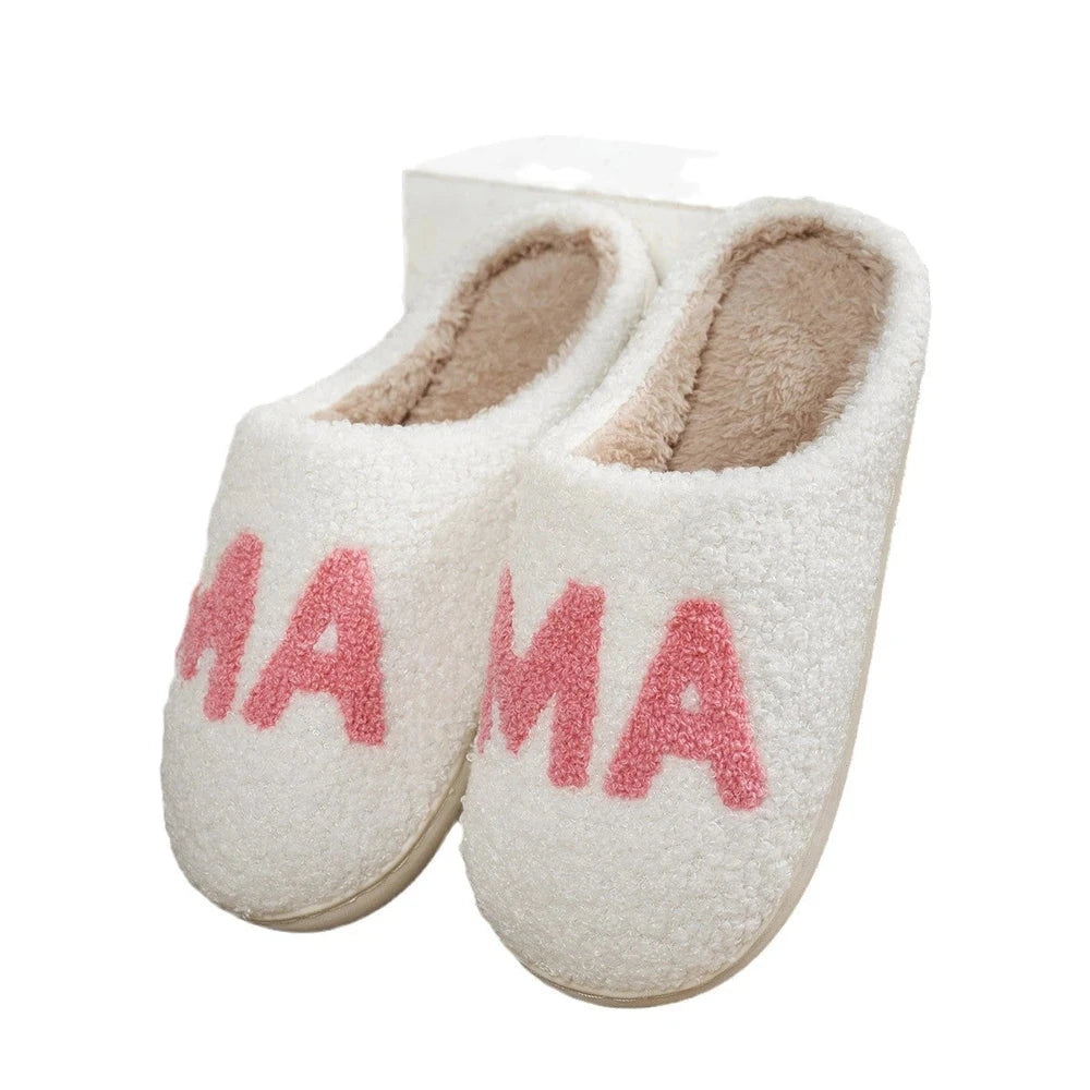 White slippers with pink 'MAMA' text on a white background